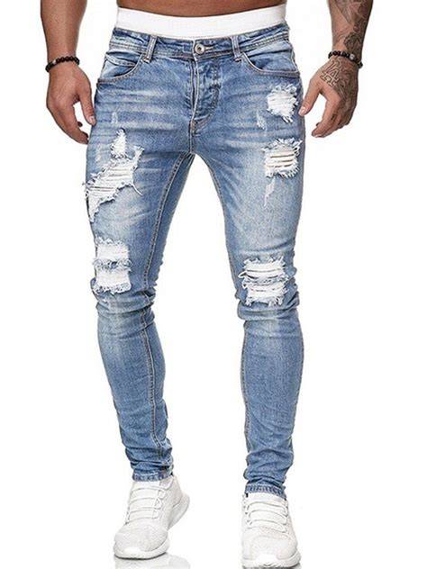 Men's distressed jeans close-up with rips