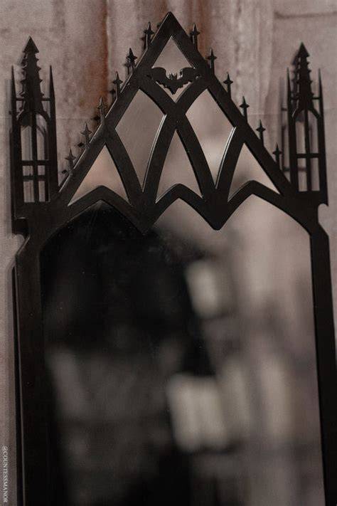 Black gothic cathedral mirror with bat emblem