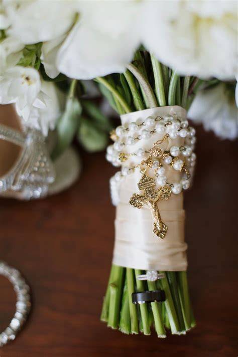 Rosary wrapped around bridal bouquet